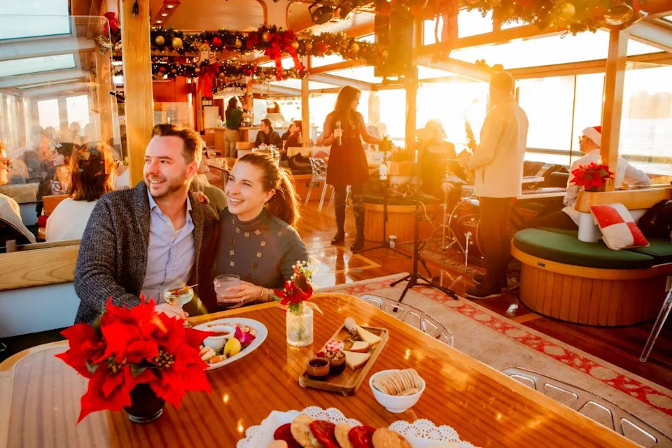 While aboard the Classic Harbor Cocoa and Carols Cruise (above), guests can sip on house-made cocoa —or something stronger if they dare — plus nibble on cookies and snap endless selfies with a watery backdrop. Classic Harbor Line