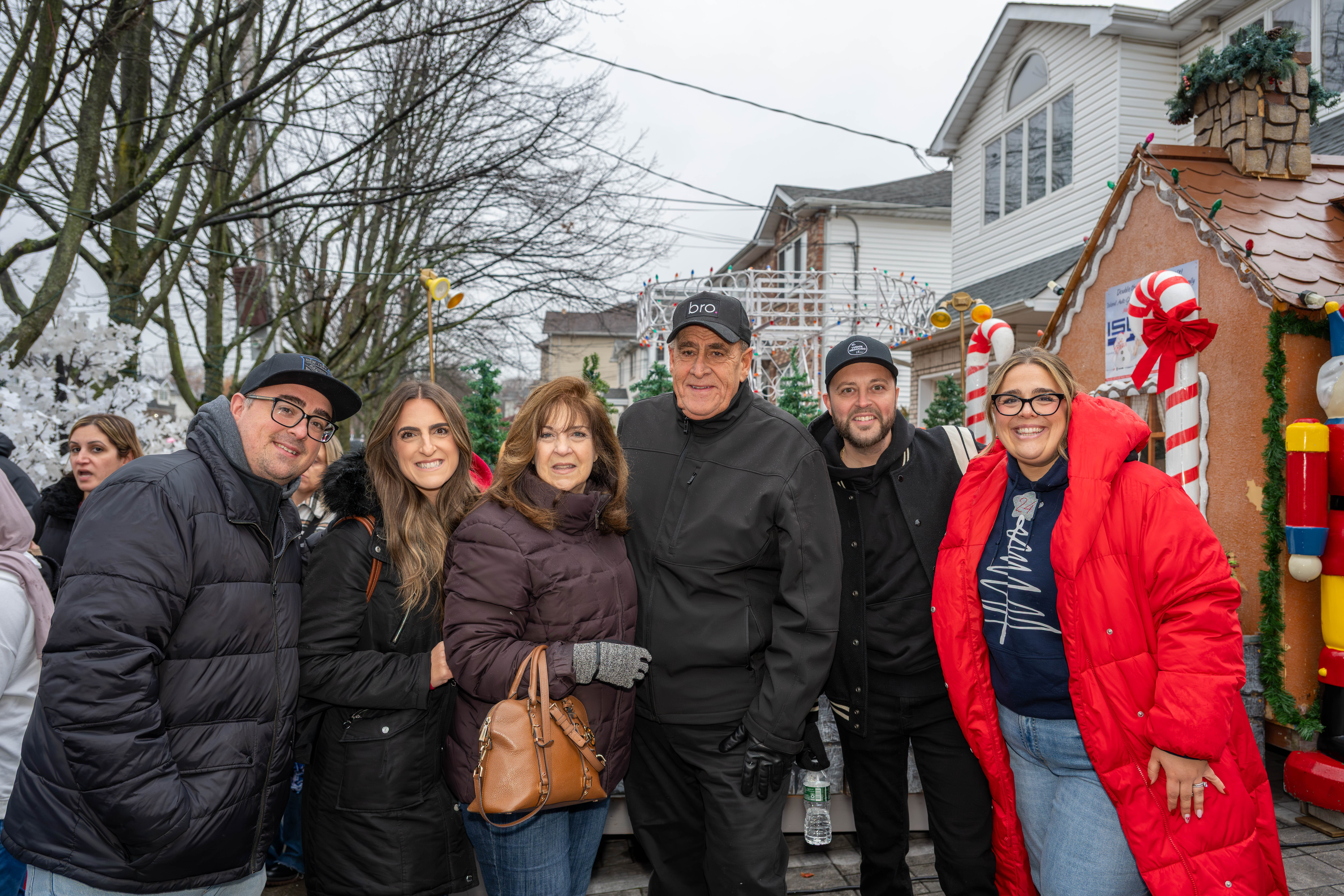 WCBS-FM 101.1 deejay, Joe Causi, (wearing a bro hat) is joined by his son, Anthony, daughter, Marie, wife Lucille, 77 WABC deejay Vinnie Medugno, and daughter Therese to help kick off Staten Island’s famous “Lights For Life” Christmas display at the home of Joseph and Marisa DiMartino on Sunday, November 30, 2025, in Charleston. (Owen Reiter for the Advance/SILive.com)