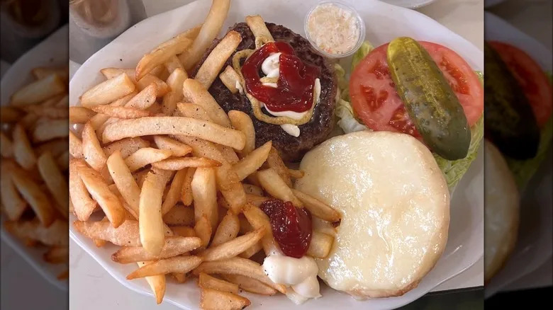 A deluxe burger plate from Joe Jr. in NYC with fries