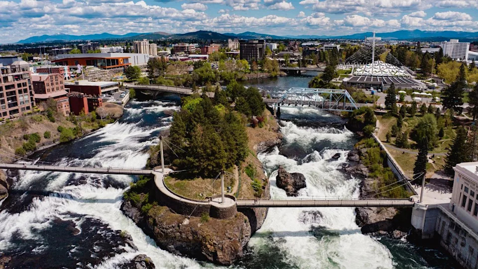 MAY 2024, SPOKEANE, WA., USA - drone aerial view of downtown Spokeane Washington focuses on City Center with Waterfalls and river