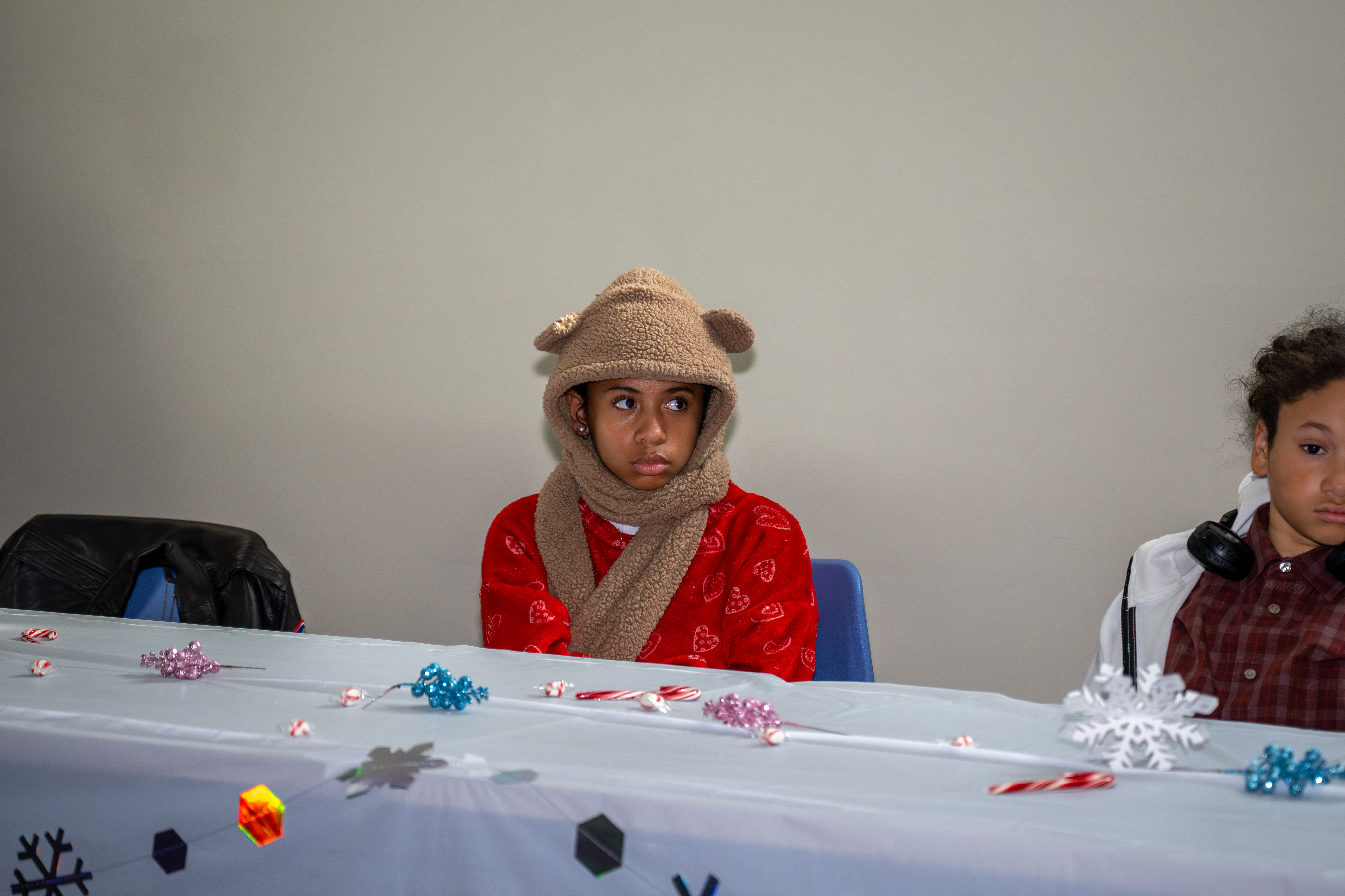 Kamora Freelend, the youngest African-American female pilot to earn her private license, and student pilot Sophie Robinson speak to middle school students at a meeting of Jack and Jill of America, Staten Island Tweens at the College of Staten Island in Willowbrook on Saturday, Dec. 20, 2025. (Owen Reiter for the Advance/SILive.com)
