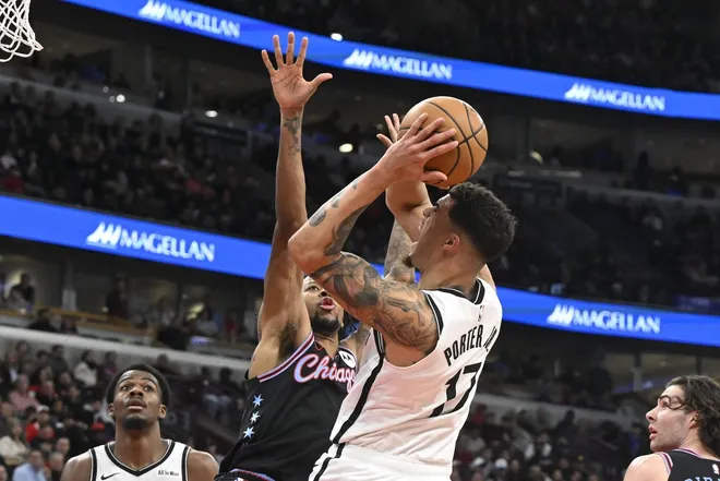 Dec 3, 2025; Chicago, Illinois, USA; Brooklyn Nets forward Michael Porter Jr. (17) drives to the basket against Chicago Bulls forward Dalen Terry (7) during the second half at the United Center.