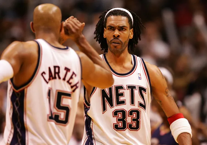 EAST RUTHERFORD, NJ - MAY 18: Vince Carter #15 and Mikki Moore #33 of the New Jersey Nets celebrate after a play against the Cleveland Cavaliers during Game Six of the Eastern Conference Semifinals during the 2007 NBA Playoffs on May 18, 2007 at the Continental Airlines Arena in the Meadowlands in East Rutherford, New Jersey. NOTE TO USER: User expressly acknowledges and agrees that, by downloading and or using this photograph, User is consenting to the terms and conditions of the Getty Images License Agreement. (Photo by Al Bello/Getty Images)