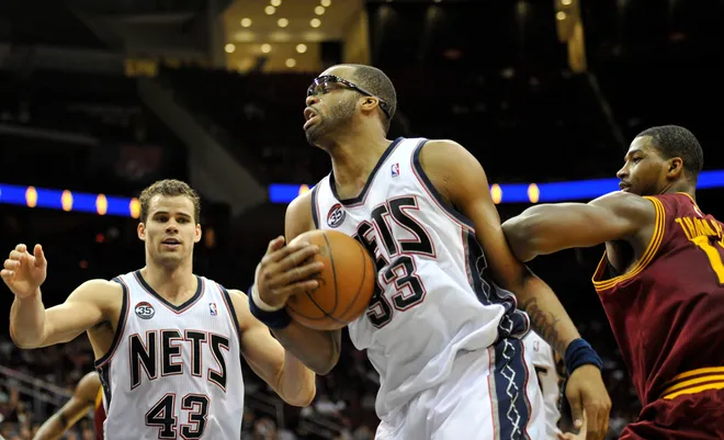 Apr 8, 2012; Newark, NJ, USA; New Jersey Nets forward Shelden Williams (33) protects a rebound during overtime at the Prudential Center against the Cleveland Cavaliers. The Nets won the game 122-118 in overtime Mandatory Credit: Joe Camporeale-USA TODAY Sports