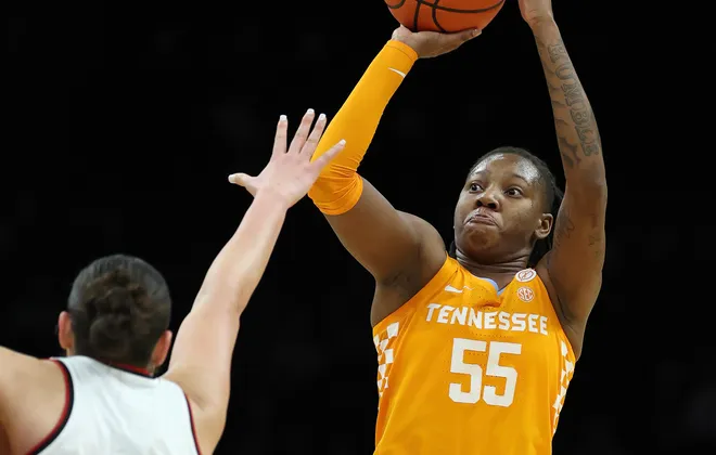 Talaysia Cooper #55 of the Tennessee Lady Volunteers takes a shot as Elif Istanbulluoglu #11 of the Louisville Cardinals defends during the 2025 Women's Champions Classic at Barclays Center on December 20, 2025 in the Brooklyn borough of New York City.