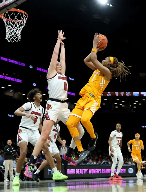 Janiah Barker #0 of the Tennessee Lady Volunteers heads for the net as Laura Ziegler #0 of the Louisville Cardinals defends during the 2025 Women's Champions Classic at Barclays Center on December 20, 2025 in the Brooklyn borough of New York City.
