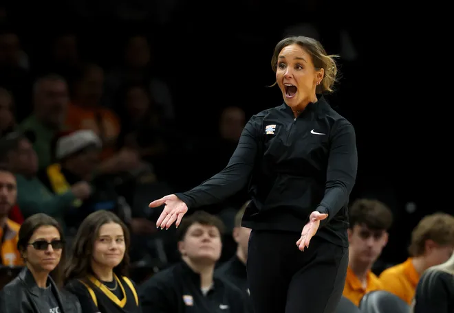 Kim Caldwell of the Tennessee Lady Volunteers directs her team in the first half against the Louisville Cardinals during the 2025 Women's Champions Classic at Barclays Center on December 20, 2025 in the Brooklyn borough of New York City.