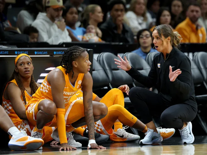 Kim Caldwell of the Tennessee Lady Volunteers talks with her players before they enter the game against the Louisville Cardinals during the 2025 Women's Champions Classic at Barclays Center on December 20, 2025 in the Brooklyn borough of New York City.