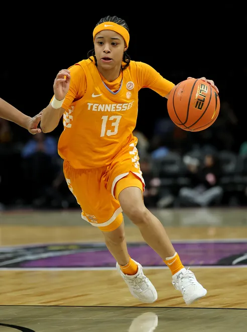 Mia Pauldo #13 of the Tennessee Lady Volunteers heads for the net in the first half against the Louisville Cardinals during the 2025 Women's Champions Classic at Barclays Center on December 20, 2025 in the Brooklyn borough of New York City.