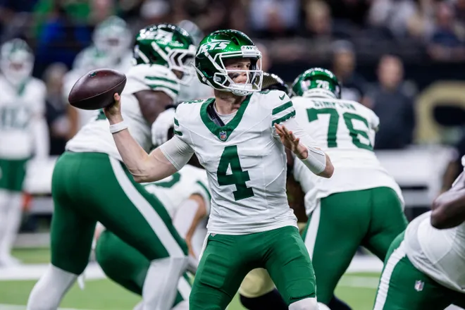 Dec 21, 2025; New Orleans, Louisiana, USA; New York Jets quarterback Brady Cook (4) passes against the New Orleans Saints during the second half at Caesars Superdome. Mandatory Credit: Stephen Lew-Imagn Images