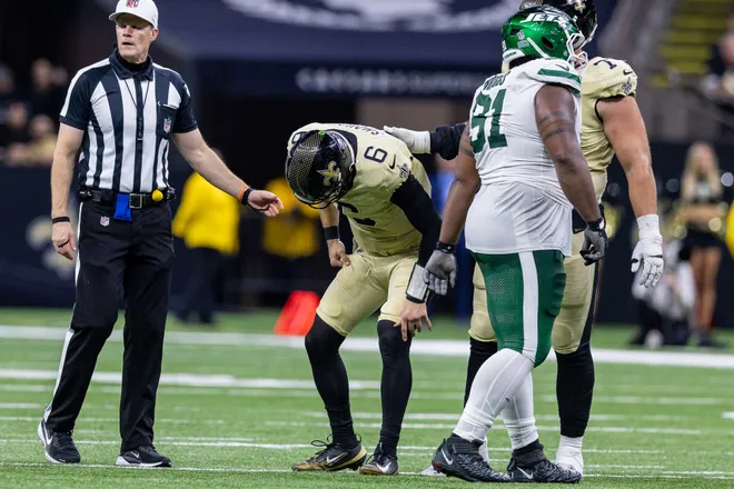 Dec 21, 2025; New Orleans, Louisiana, USA; New Orleans Saints quarterback Tyler Shough (6) gets up after a tackle by New York Jets defensive end Jowon Briggs (91) during the second half at Caesars Superdome. Mandatory Credit: Stephen Lew-Imagn Images