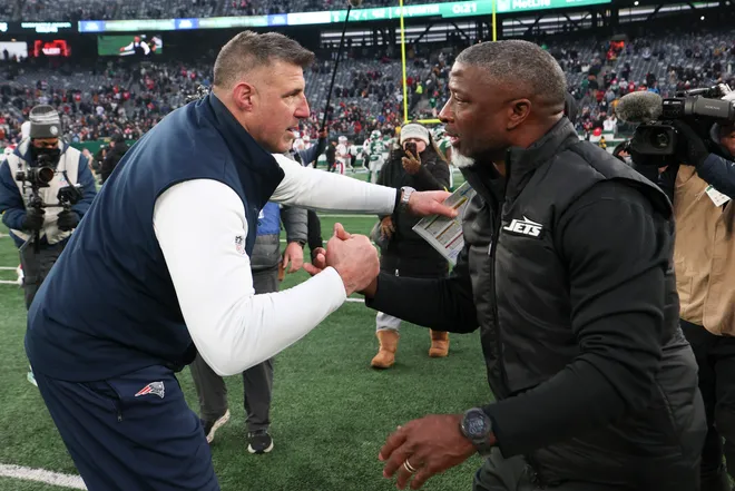 Dec 28, 2025; East Rutherford, New Jersey, USA; New England Patriots head coach Mike Vrabel and New York Jets head coach Aaron Glenn shake hands after the game at MetLife Stadium. Mandatory Credit: Vincent Carchietta-Imagn Images