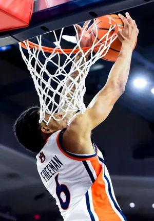 Auburn Tigers guard Elyjah Freeman (6) puts in an alley-oo dunk against Queens University of Charlotte during their game at Neville Arena on the Auburn University campus in Auburn, Ala., on Monday evening December 29, 2025.