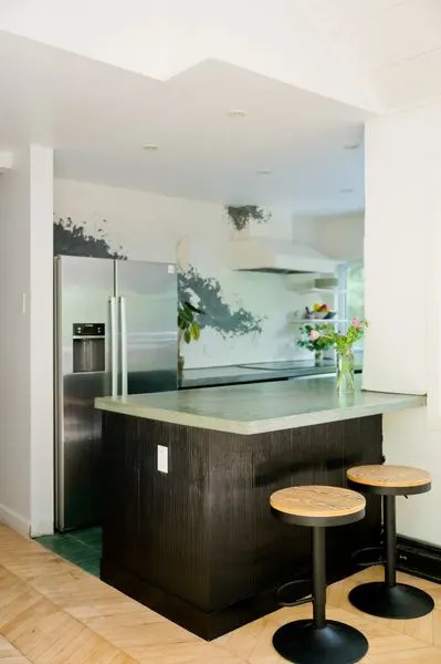 The flooring is made of one-inch thick reclaimed maple chevron floors.