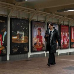 A person walks past posters promoting the campaign by Bath & Body Works at Grand Central station, Wednesday, Nov. 19, 2025, in New York. AP Photo/Yuki Iwamura