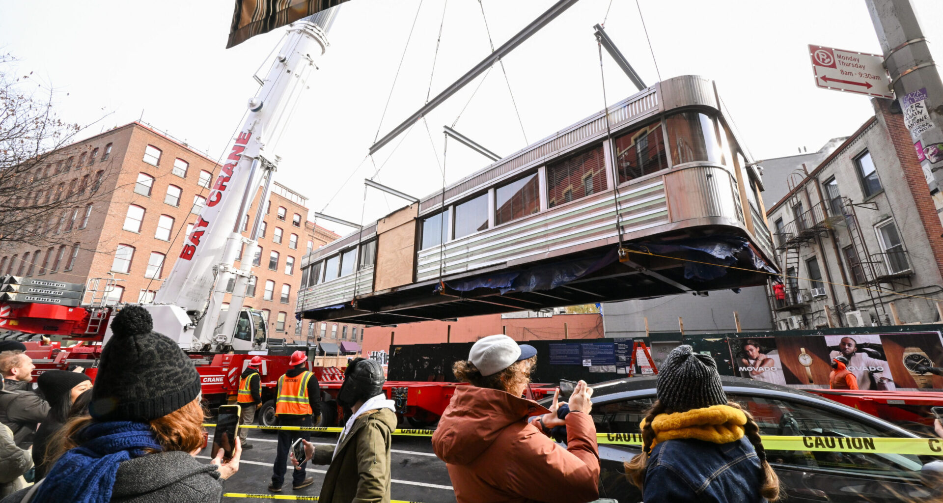 A 60-foot, 50-ton diner from Williamsburg is lifted into the air by crane and placed onto a flatbed truck for transport to its new home at Steiner Studios, Saturday, Dec. 6, 2025, in Brooklyn. The beloved Diner is being saved by Steiner Studios owner, Doug Steiner. Photo by Diane Bondareff/AP Content Services for Steiner Studios