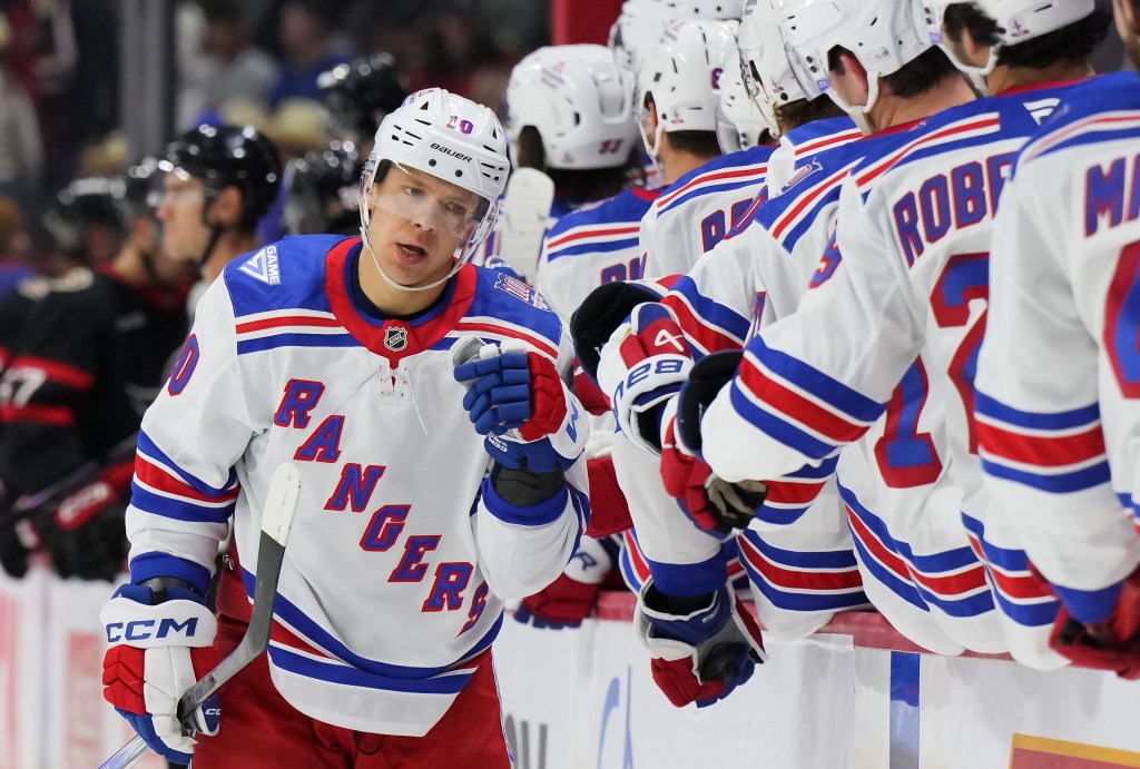 Artemi Panarin accepts congratulations from teammates after scoring an empty-net goal for his 900th career point in the Rangers' 4-2 road win over the Senators on Dec. 4, 2025.