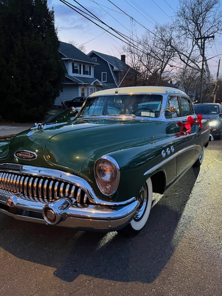 Local businesses offered festive treats along Forest Avenue as Santa arrived in a horse-drawn carriage for the community celebration.