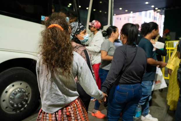 Migrants arrive on a bus from Texas at the Port Authority Bus Terminal in Manhattan in September 2022.