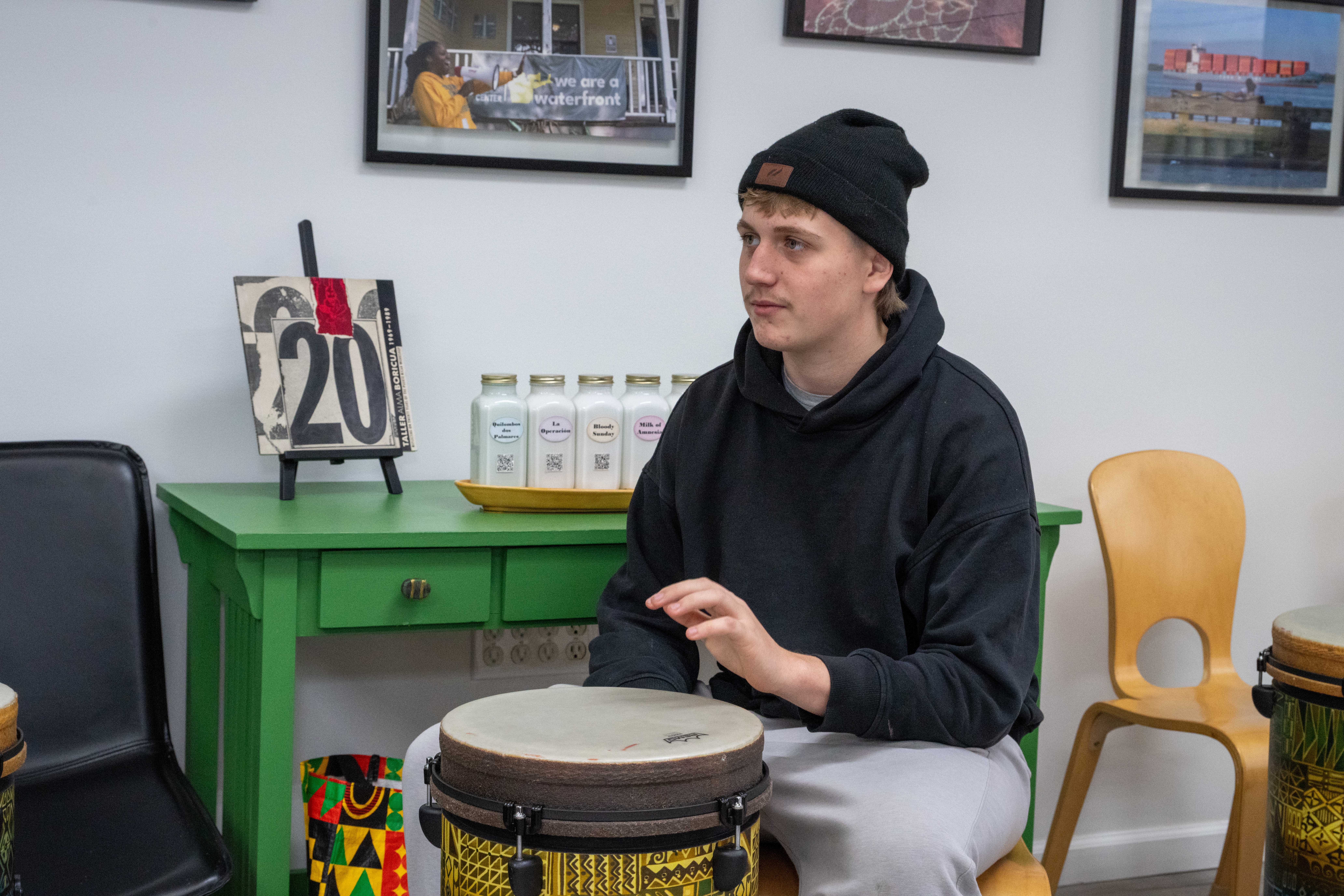 Maxymilian Zygmanski gets drum lessons from Gregory Taylor at the grand opening of the Staten Island Urban Center’s new storefront at 206 Bay Street in Tompkinsville on Saturday, December 6, 2025. (Owen Reiter for the Advance/SILive.com)