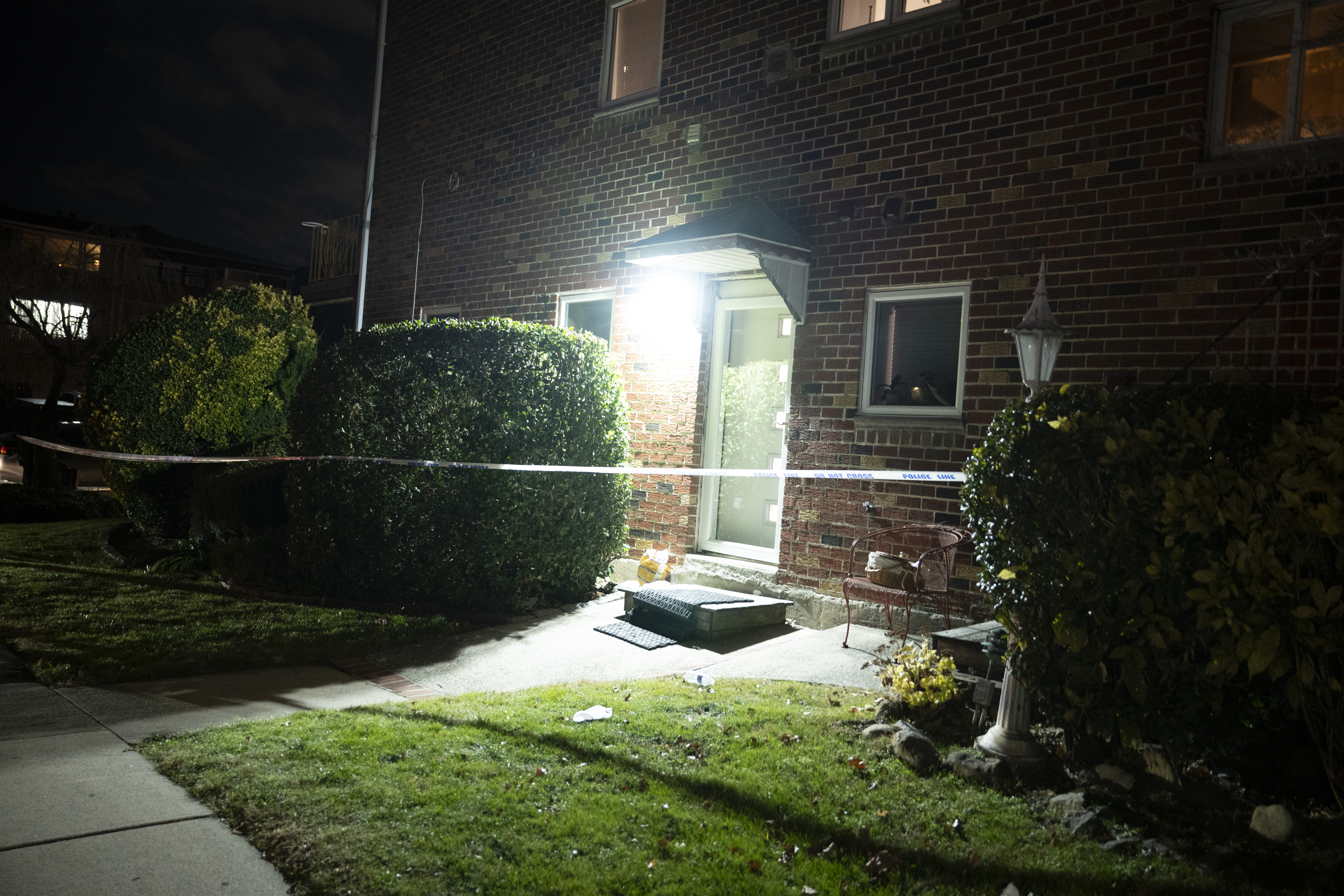 Detectives investigate the scene of a double stabbing that left one man dead and a woman in critical condition.