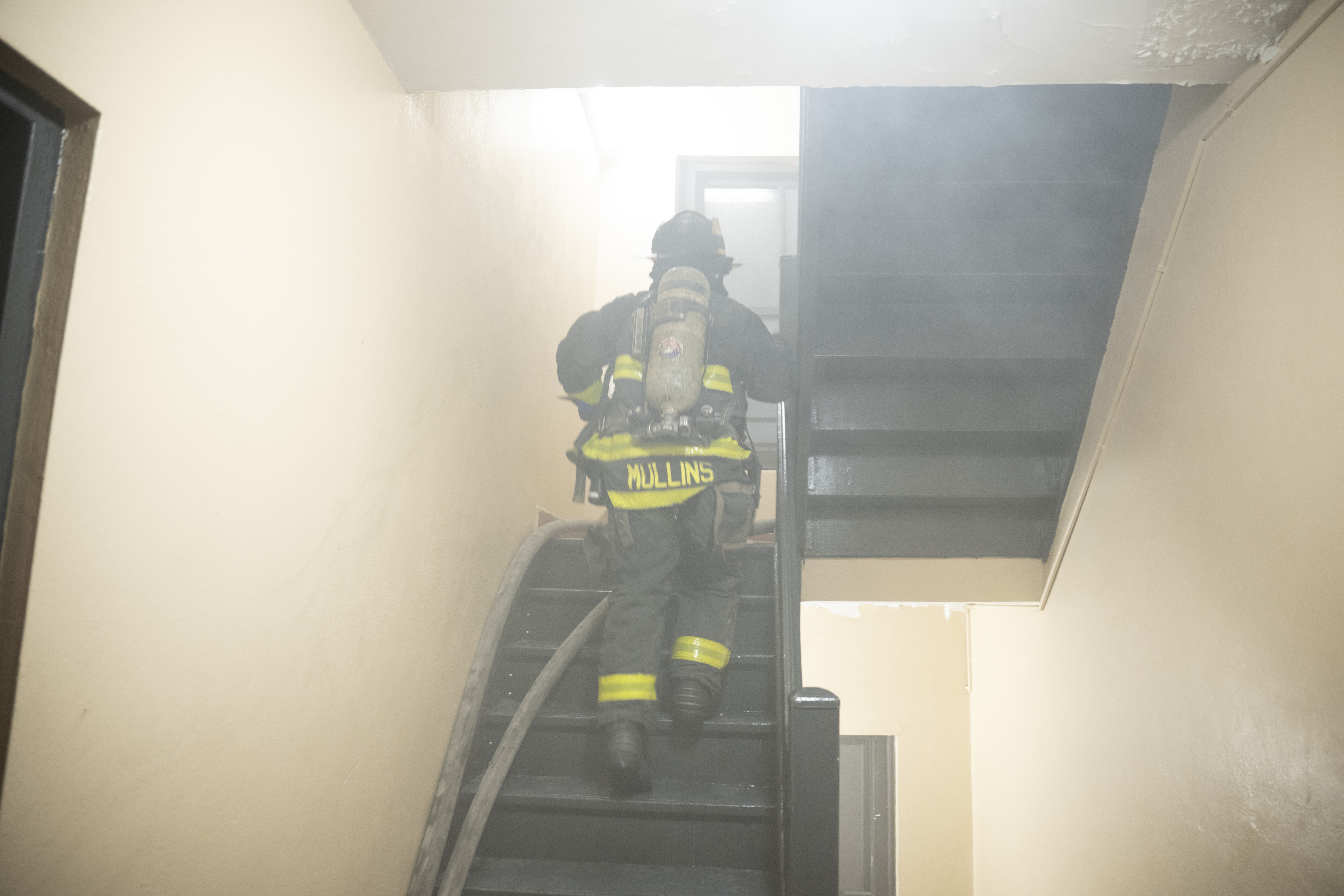 Fire Department personnel in the apartment building.