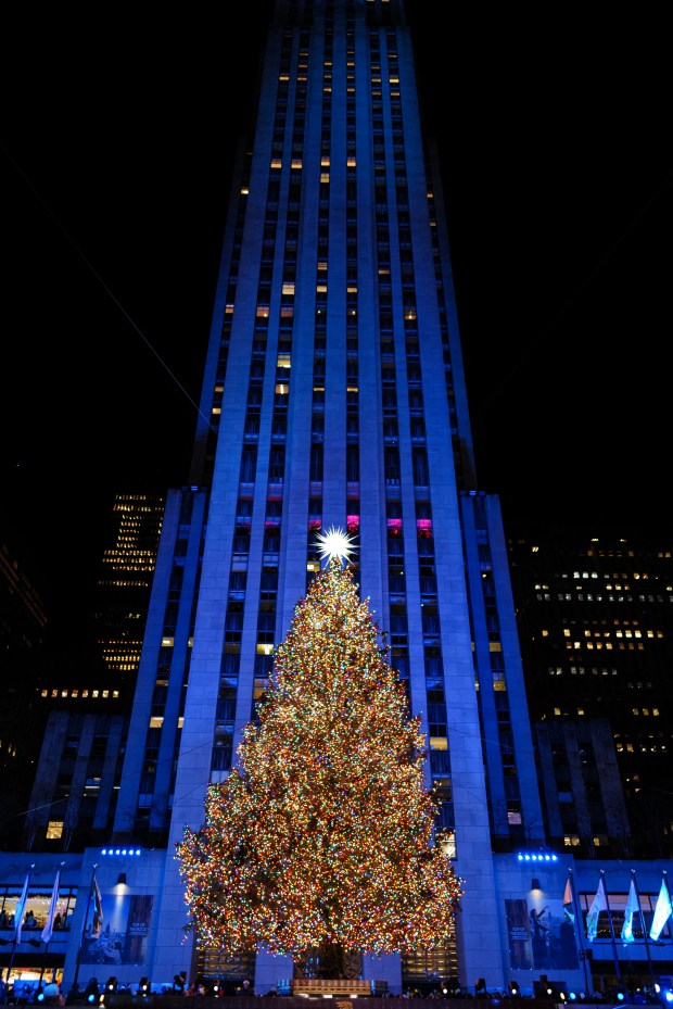 The Christmas tree stands illuminated moments after being lit during the Rockefeller Center Christmas Tree Lighting in New York City on December 3, 2025. (Photo by CHARLY TRIBALLEAU / AFP via Getty Images)