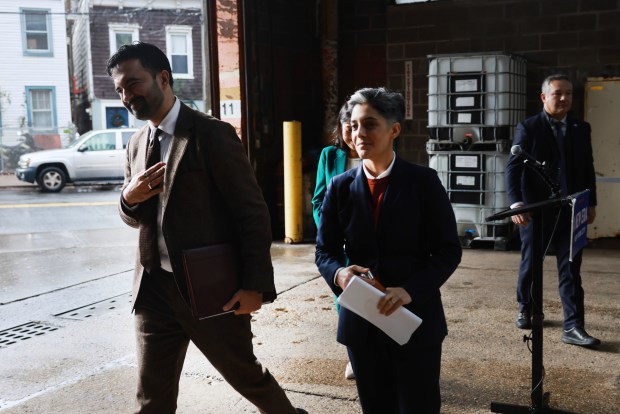 Mayor-elect Zohran Mamdani finishes a news conference in Staten Island after announcing two deputy mayors on Friday. Mamdani announced Leila Bozorg (right) as his deputy mayor for housing.
