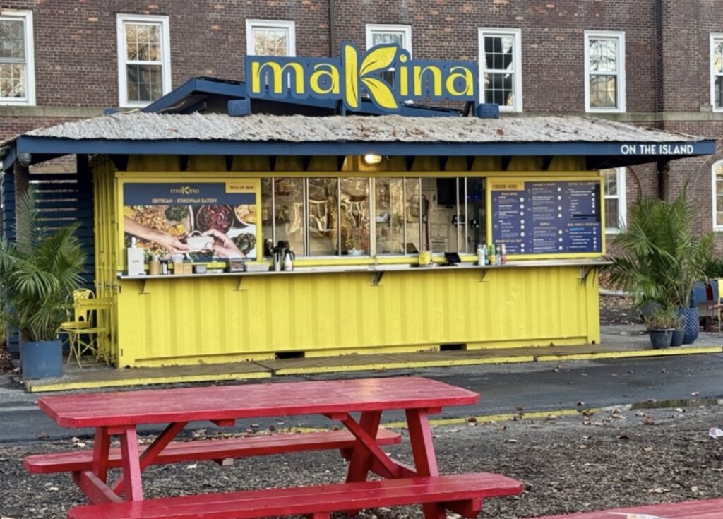 Makina Café serves Eritrean and Ethiopian dishes from a bright yellow stand. (Credit: Baron Carr)