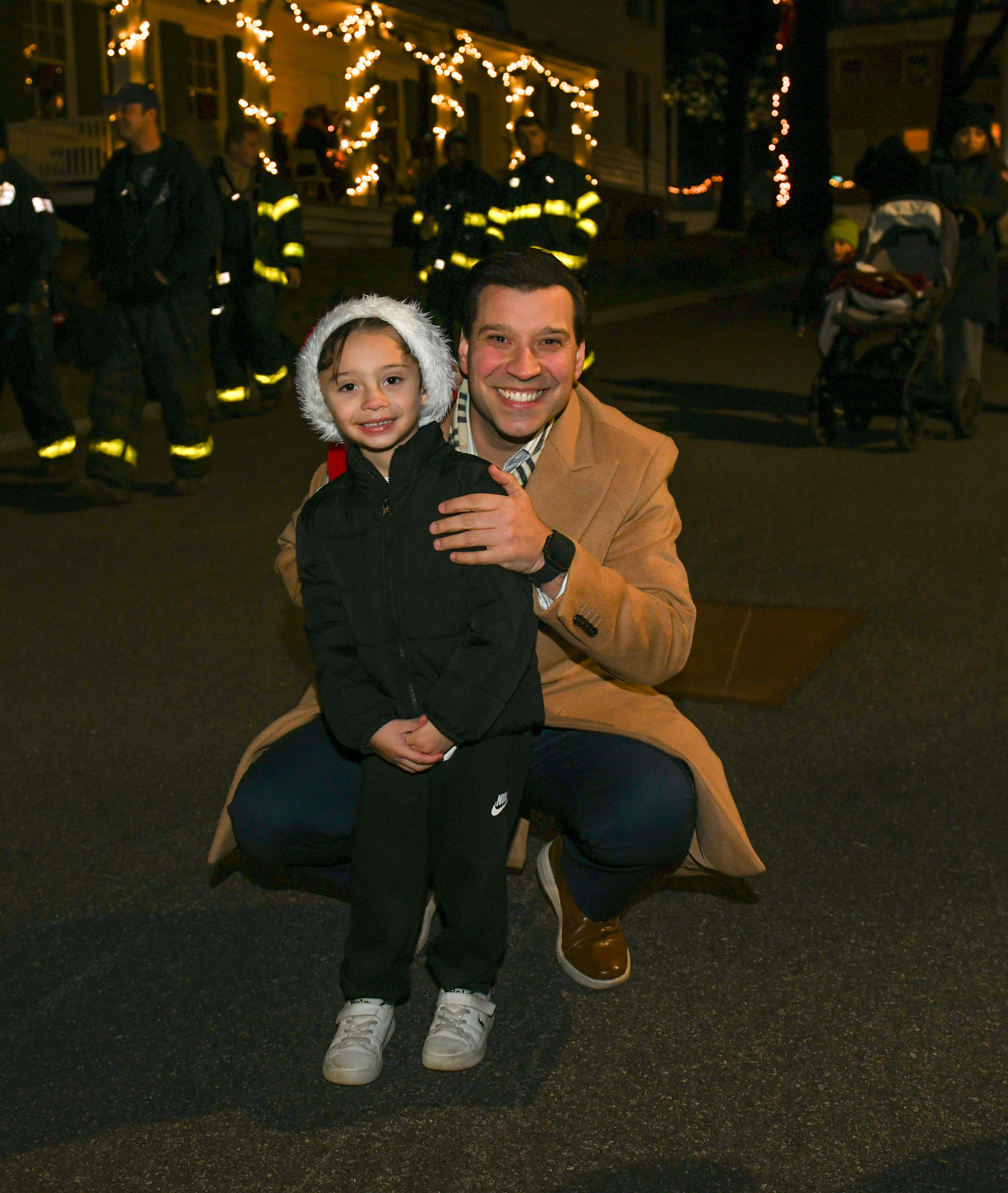Robert Birkhead and his son, Robert Jr. 5, at the tree lighting at Historic Richmondtown on Dec. 5, 2025. (Steve White for the Advance/SILive.com)