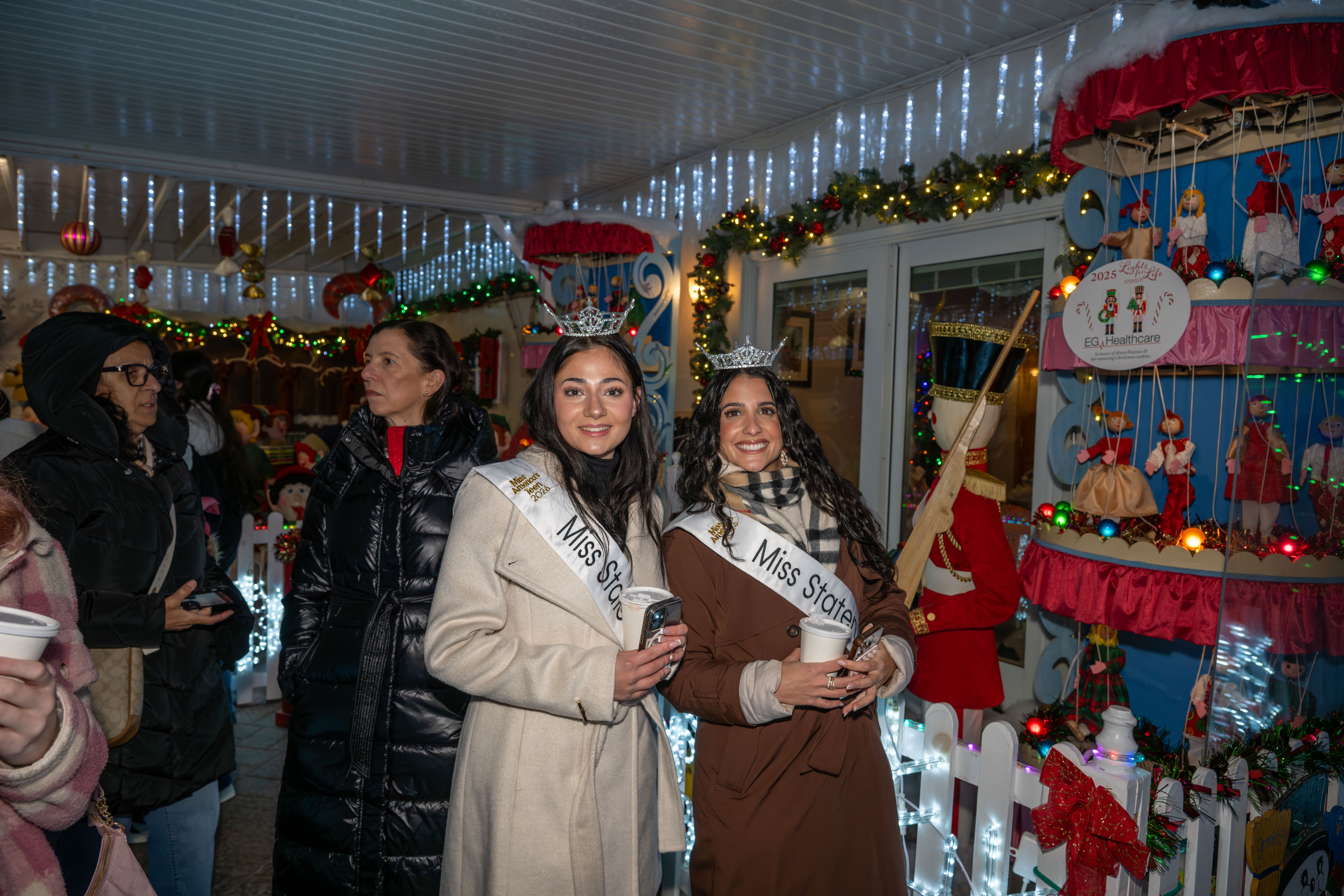 Miss Staten Island Teen Victoria DiPaolo and Miss Staten Island Gabriella Marinelli help kick off Staten Island’s famous “Lights For Life” Christmas display at the home of Joseph and Marisa DiMartino on Sunday, November 30, 2025, in Charleston. (Owen Reiter for the Advance/SILive.com)