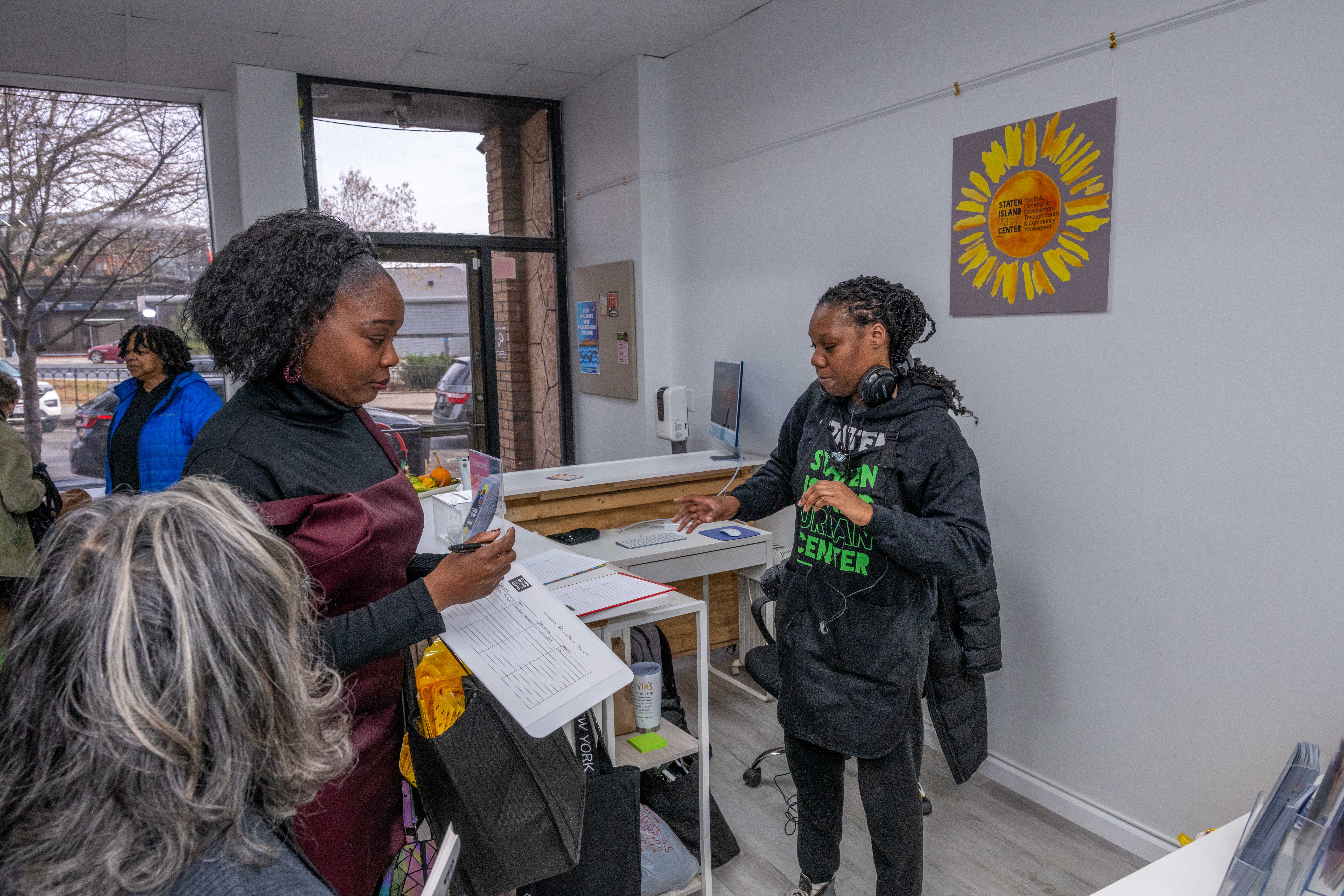 More than one hundred people turned out for the grand opening of the Staten Island Urban Center’s new storefront at 206 Bay Street in Tompkinsville on Saturday, December 6, 2025. (Owen Reiter for the Advance/SILive.com)