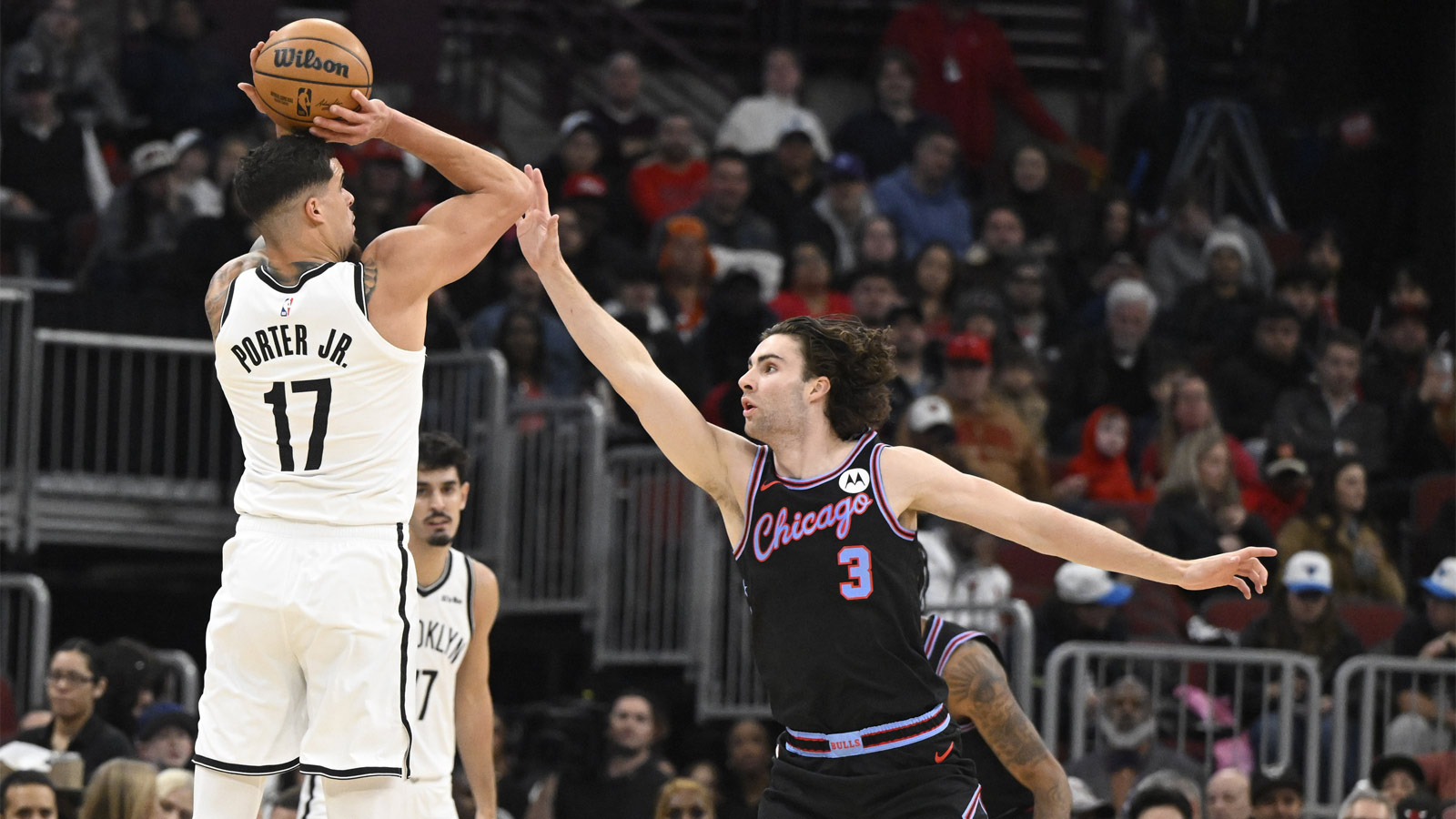 Brooklyn Nets forward Michael Porter Jr. (17) shoots against Chicago Bulls guard Josh Giddey (3) during the first half at the United Center.