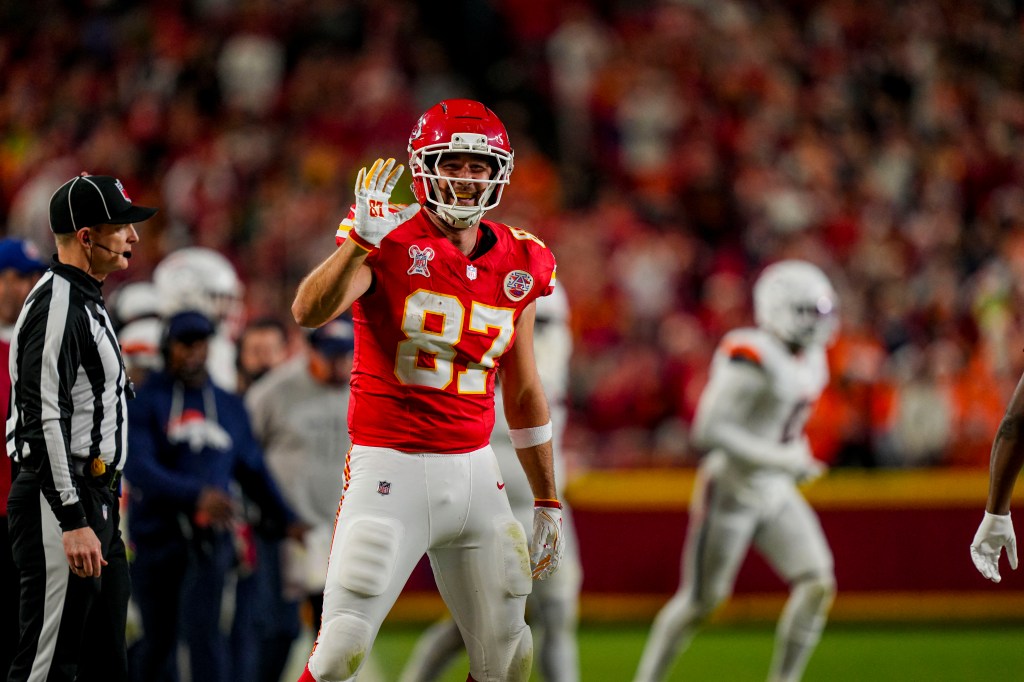 Kansas City Chiefs tight end Travis Kelce (87) celebrates after first down during the second quarter at GEHA Field at Arrowhead Stadium. 