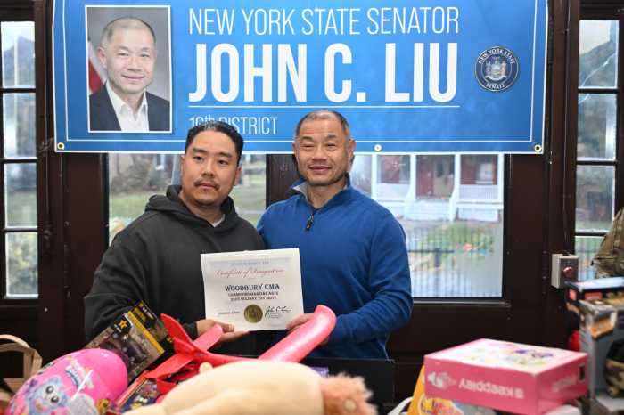 Liu poses with Michael Ro of Champions Martial Arts. Photo by Ramy Mahmoud.