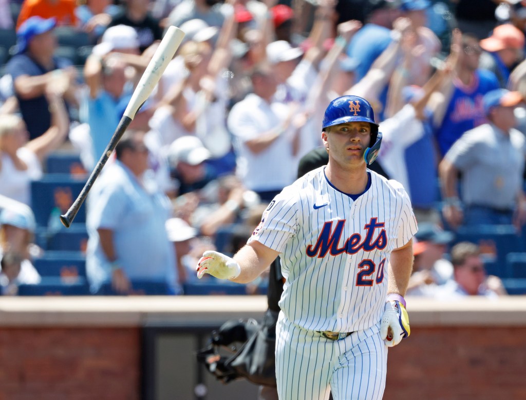 Pete Alonso #20 of the New York Mets flips his bat after he hits a three-run home run during the third inning. 
