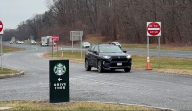 Black suv entering rest stop along Interstate 90 E in New York.