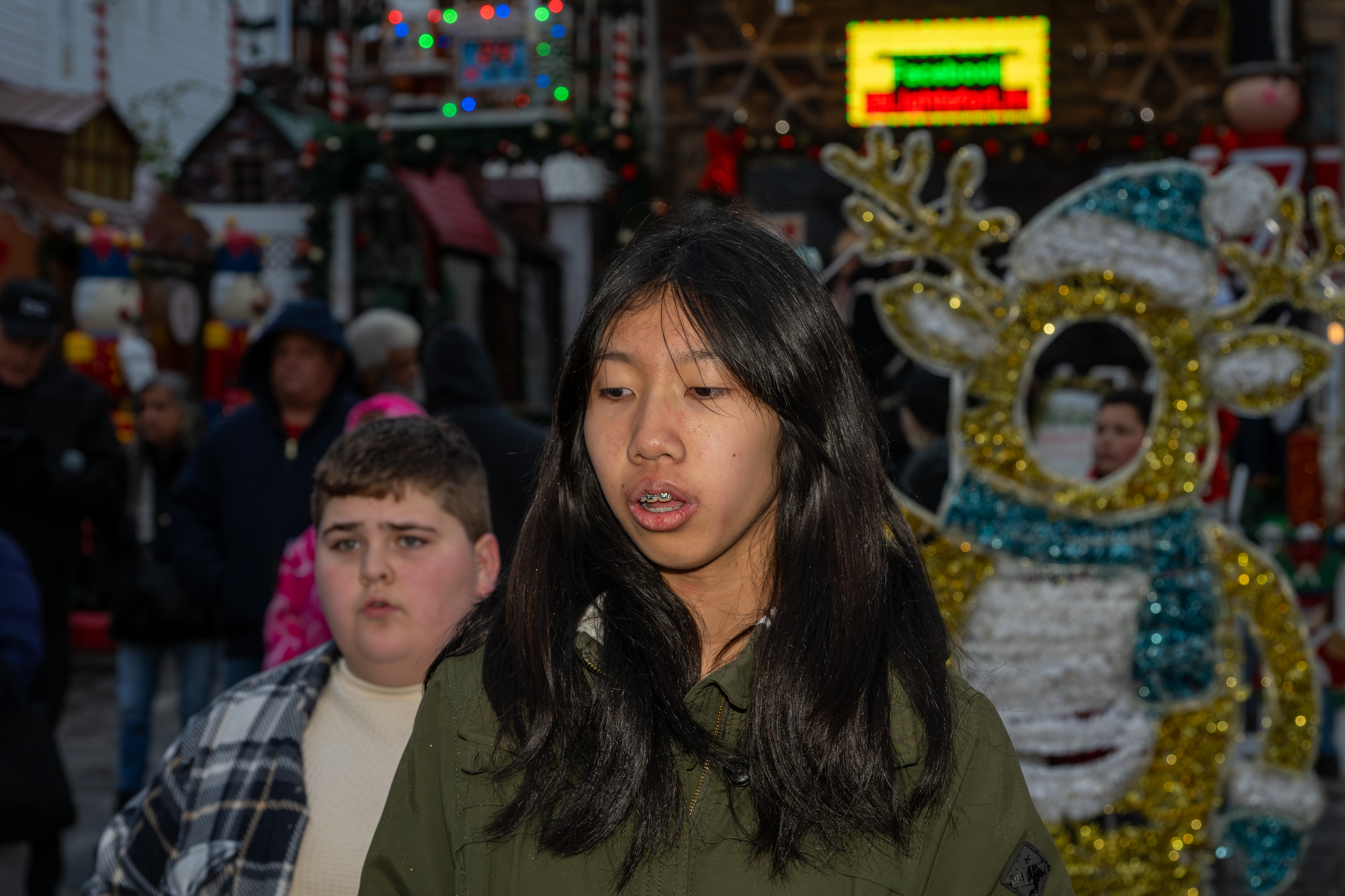 Police Officer Rocco Laurie Intermediate School (I.S. 72) Chorus entertains the crowd at Staten Island’s famous “Lights For Life” Christmas display at the home of Joseph and Marisa DiMartino on Sunday, November 30, 2025, in Charleston. (Owen Reiter for the Advance/SILive.com)