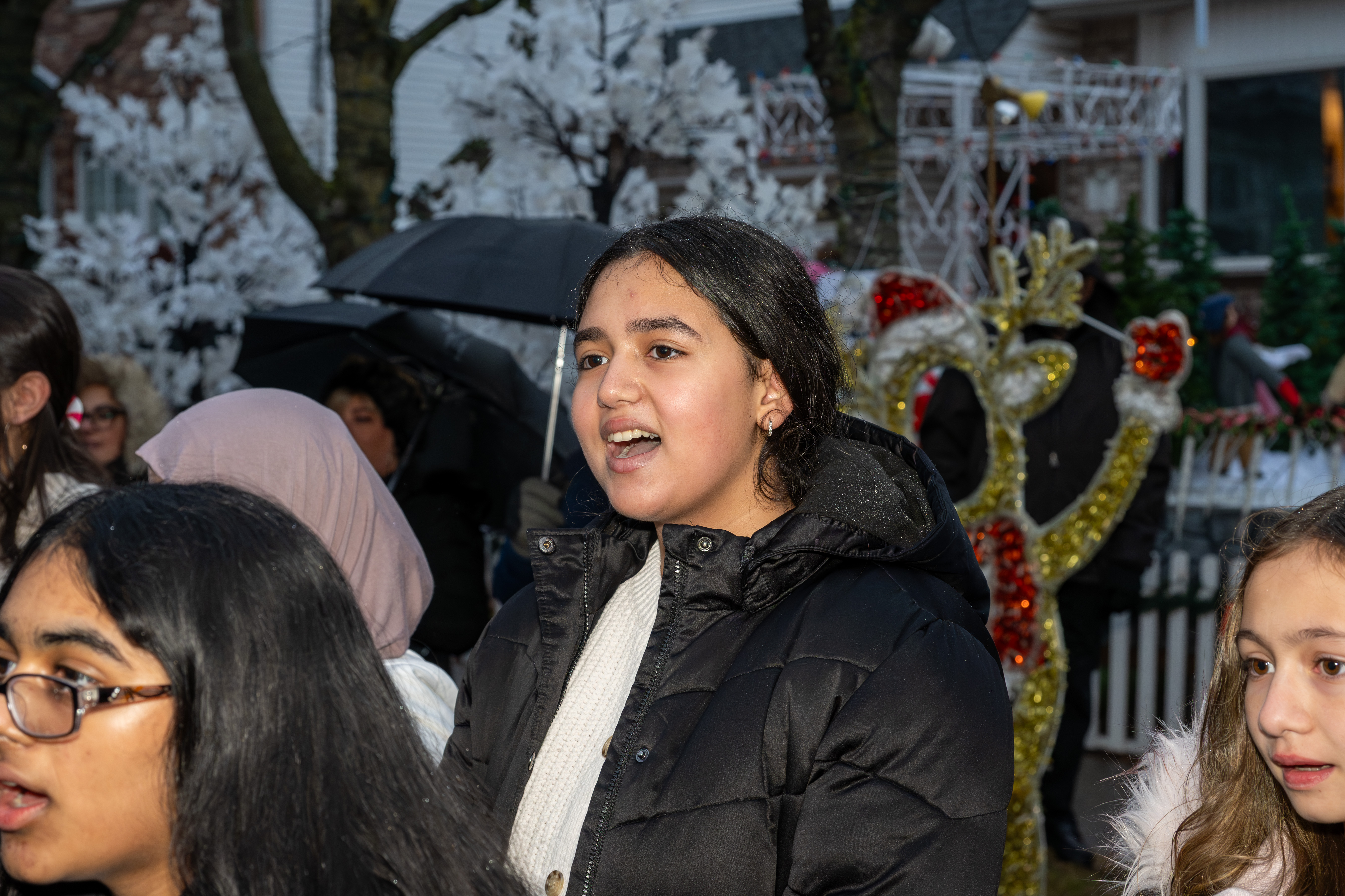 Police Officer Rocco Laurie Intermediate School (I.S. 72) Chorus entertains the crowd at Staten Island’s famous “Lights For Life” Christmas display at the home of Joseph and Marisa DiMartino on Sunday, November 30, 2025, in Charleston. (Owen Reiter for the Advance/SILive.com)