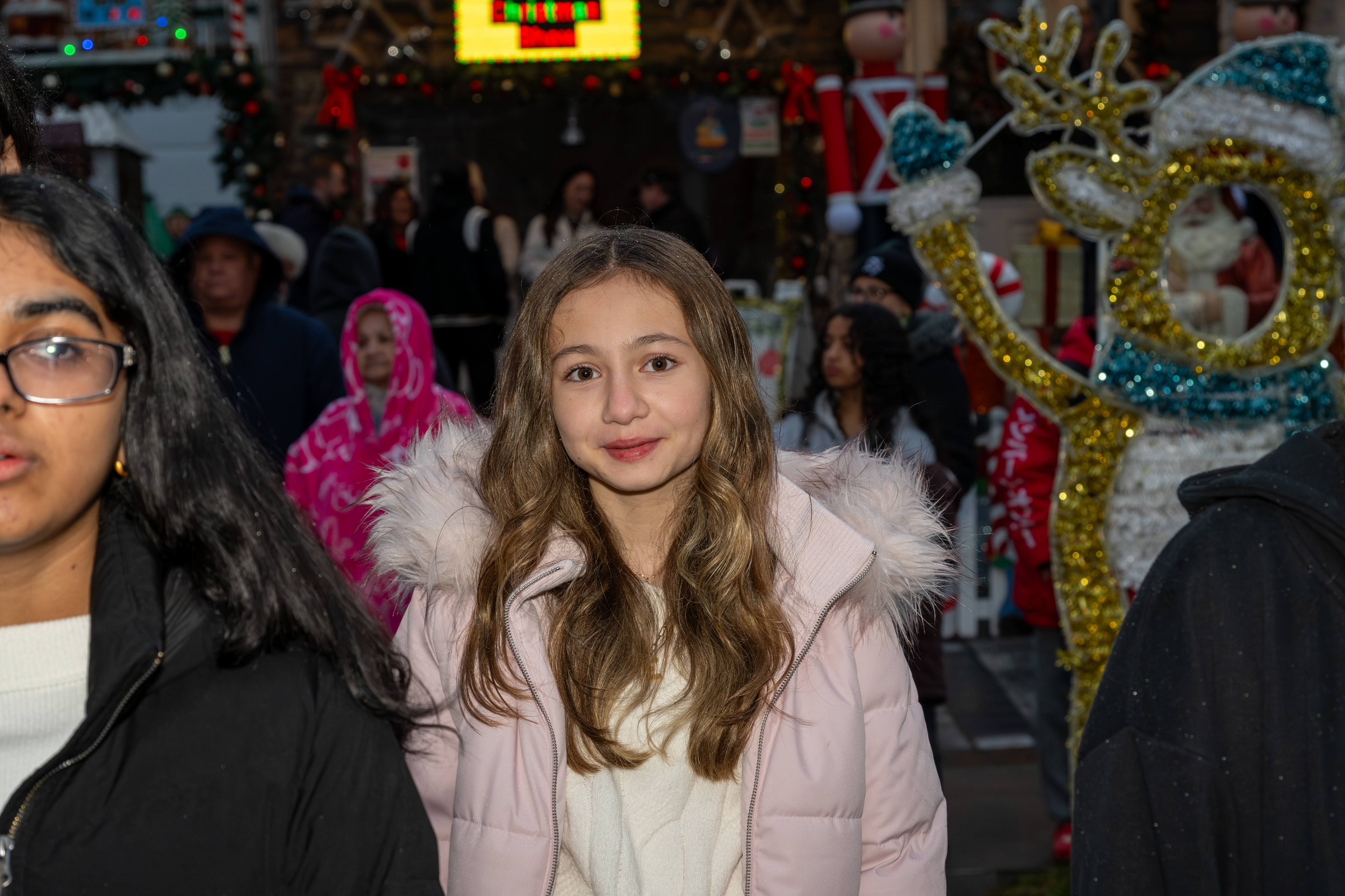 Police Officer Rocco Laurie Intermediate School (I.S. 72) Chorus entertains the crowd at Staten Island’s famous “Lights For Life” Christmas display at the home of Joseph and Marisa DiMartino on Sunday, November 30, 2025, in Charleston. (Owen Reiter for the Advance/SILive.com)