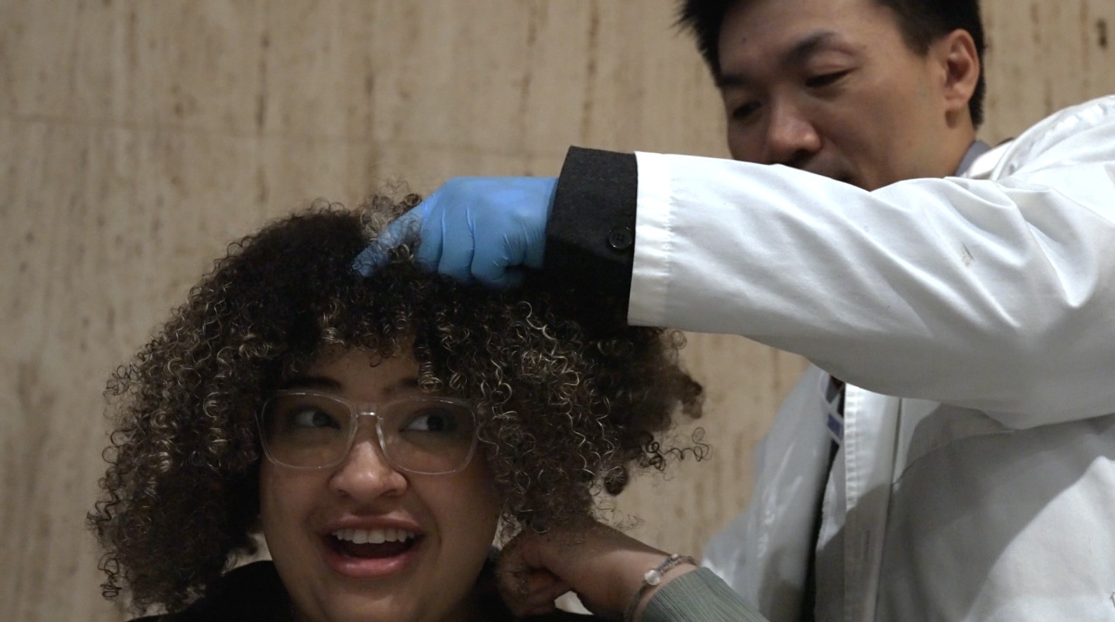 Dr. Cai Bin works on a patient.