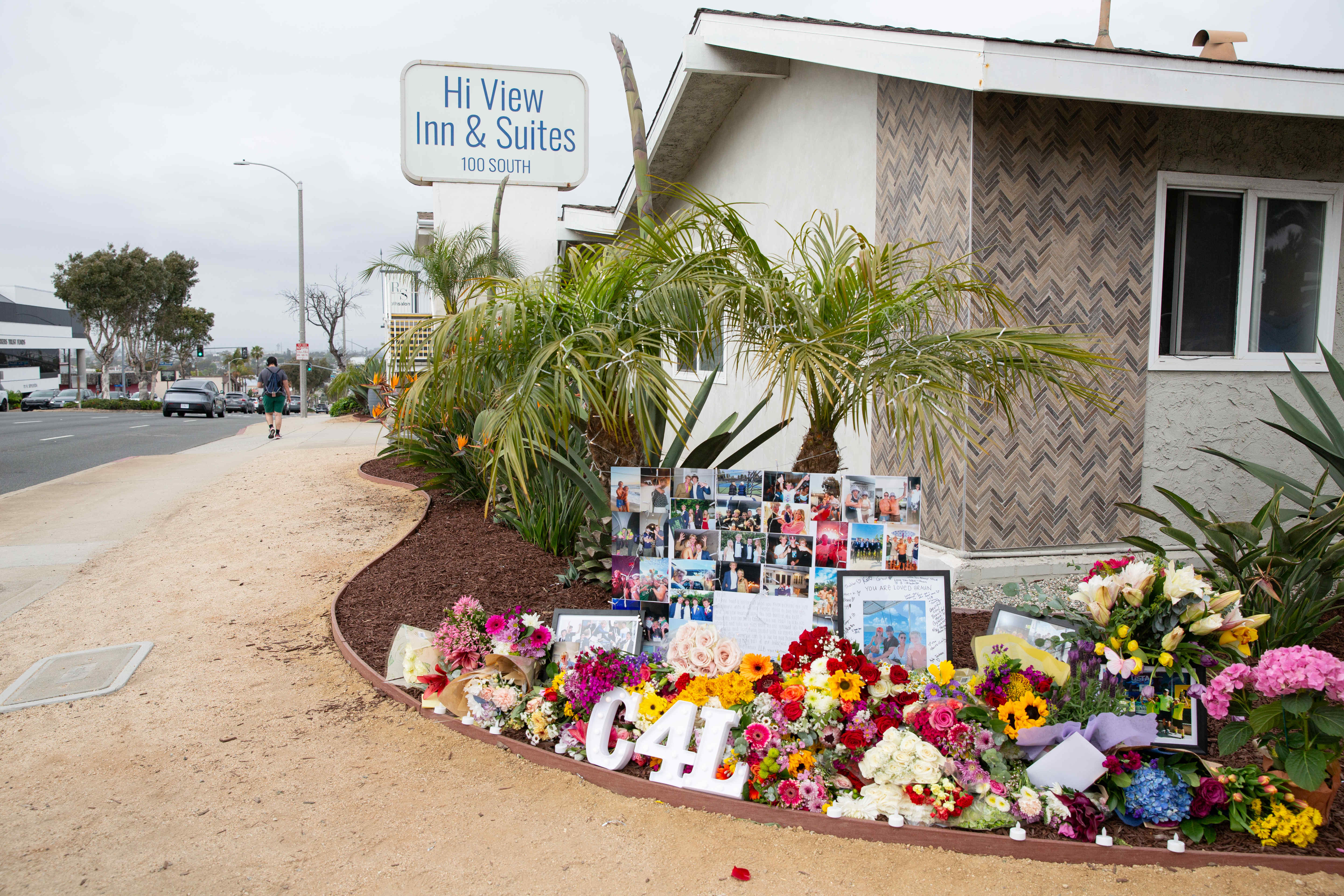 Flowers, candles and photos adorn a memorial for 18-year-old Braun...