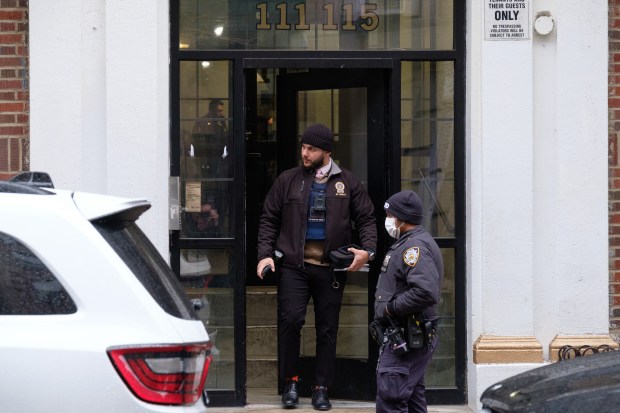 Police investigate after a woman was found shot to death inside 115 W. 141 St. in Manhattan, New York on Tuesday, December 23, 2025. (Gardiner Anderson / New York Daily News)