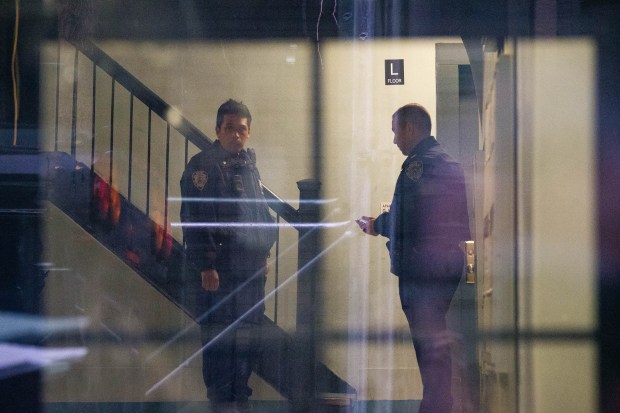 Police investigate after a woman was found shot to death inside 115 W. 141 St. in Manhattan, New York on Tuesday, December 23, 2025. (Gardiner Anderson / New York Daily News)