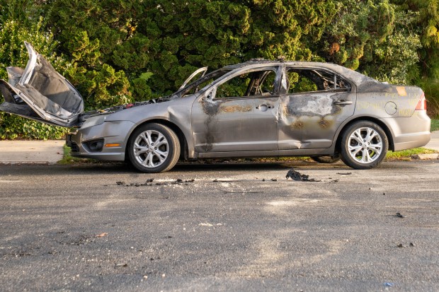 A Queens man was assaulted as several men in cars sped through the neighborhood performing donuts on the street, authorities said.