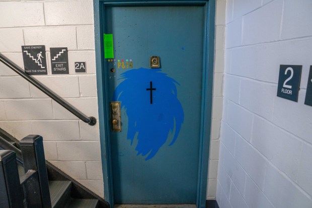 A green police seal is seen on the door of missing child Jacob Pritchett's apartment on Howard Avenue in Brooklyn on Friday.