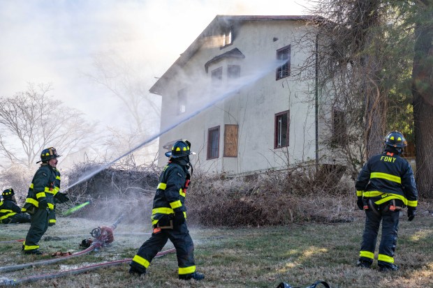 A vacant Bronx home that sold for $3.3 million in 2022 was destroyed by a fire that started in the basement of the Palisades Ave. home near Ladd Road in North Riverdale on Friday, Dec. 12, 2025. (Theodore Parisienne / New York Daily News)