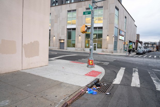Trevor Lloyd Samuels was struck and killed by a scooter while crossing 168th St. near 93rd Ave. in Jamaica, Queens, on Friday, Dec. 5, 2025. Yunior Buleje Rodriguez was charged with aggravated unlicensed operation of a motor vehicle following the fatal crash. (Theodore Parisienne / New York Daily News)