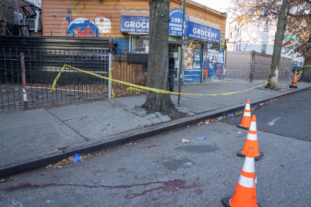 One man was killed and another wounded in a double-shooting on 108th St. near Waldron St. in Corona, Queens, on Thursday, Dec. 11, 2025. (Theodore Parisienne / New York Daily News)