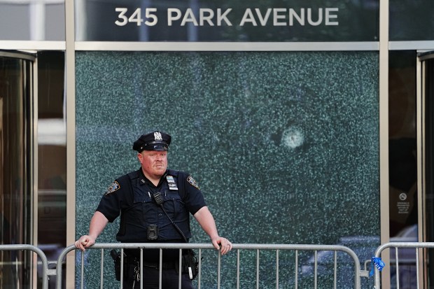 NYPD officers are pictured outside 345 Park Ave. in Manhattan on Tuesday, July 29, 2025. The building is the scene where A police officer and three other people were killed after a gunman with a history of mental illness opened fire with an M-4 rifle in the lobby of a Midtown Manhattan office building that houses The Blackstone Group, Rudin Management and NFL headquarters. (Barry Williams/New York Daily News)